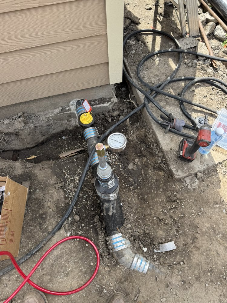 Backflow assembly with pressure gauge during a leak test