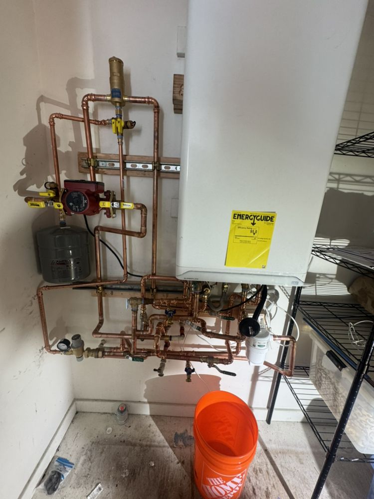 Newly installed tankless water heater with copper piping by 5Star Plumbing Apartment